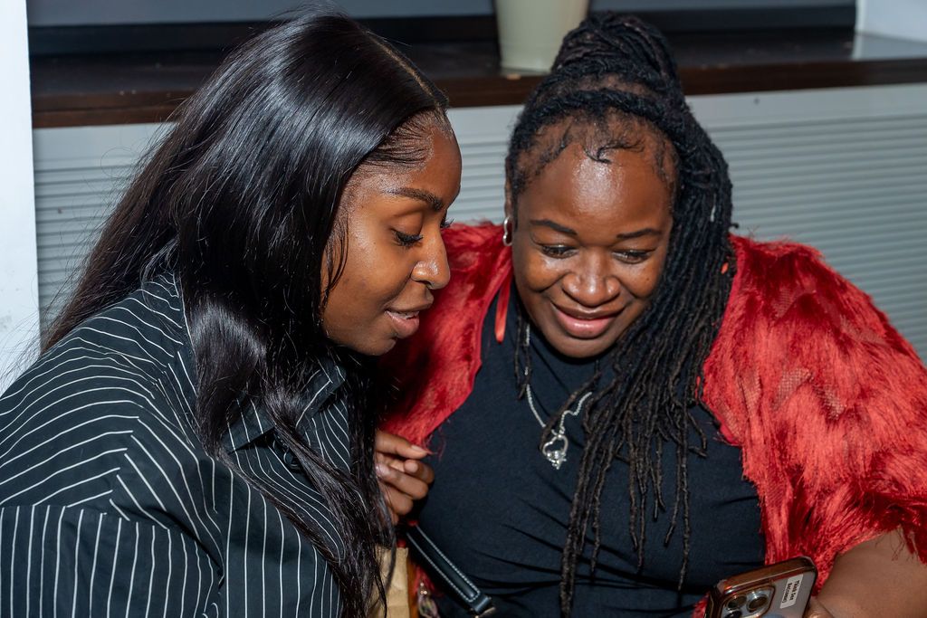 Two members sharing a joke at the Unify Social 2026