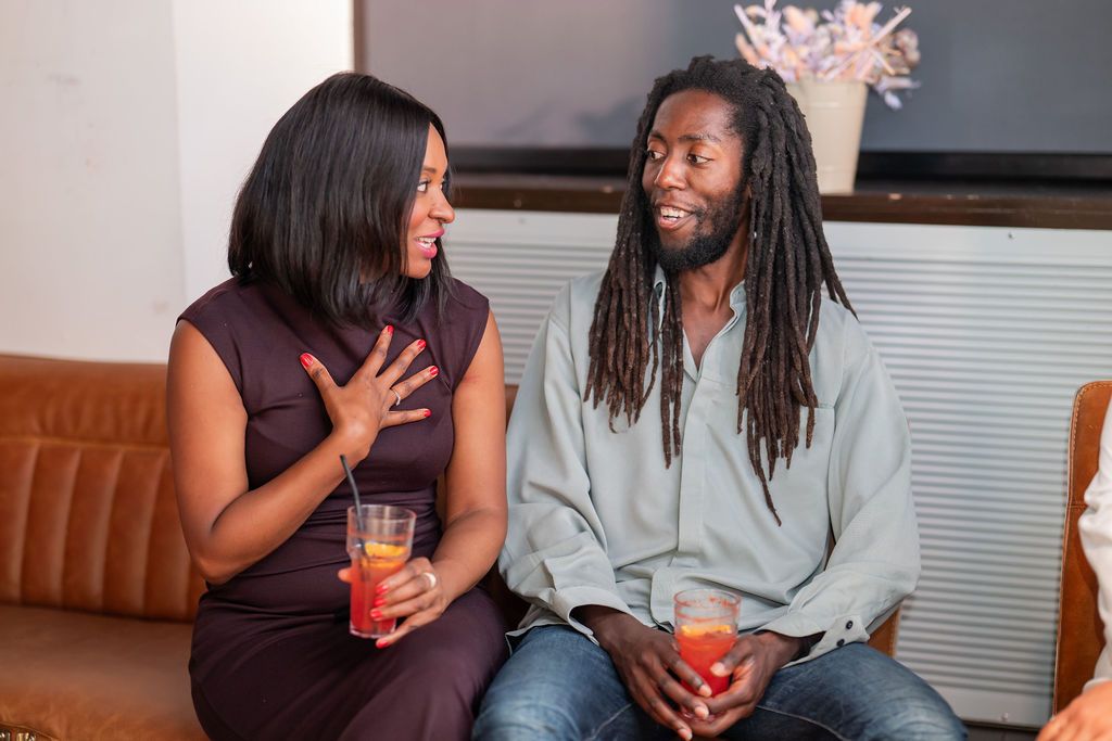 Two members deep in conversation at the Unify Social 2026