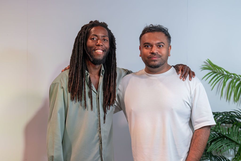 Two members smiling together at the Unify Social 2026