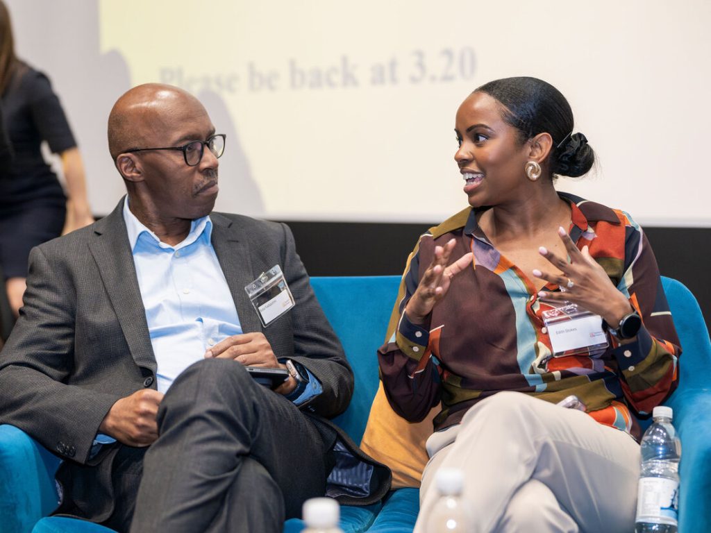 A panel discussion in progress at the conference
